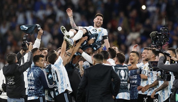 Argentina's Lionel Messi celebrates after winning the Finalissima with teammates.