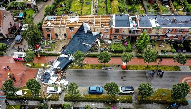An aerial view shows the damage to the roof of adjacent buildings after a tornado ripped through the southwestern seaside city of Zierikzee. AFP