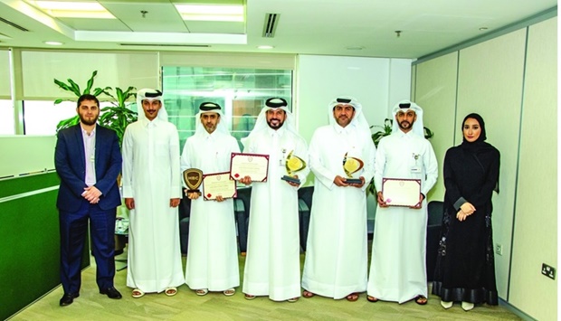 Officials with the awards won by Ashghal