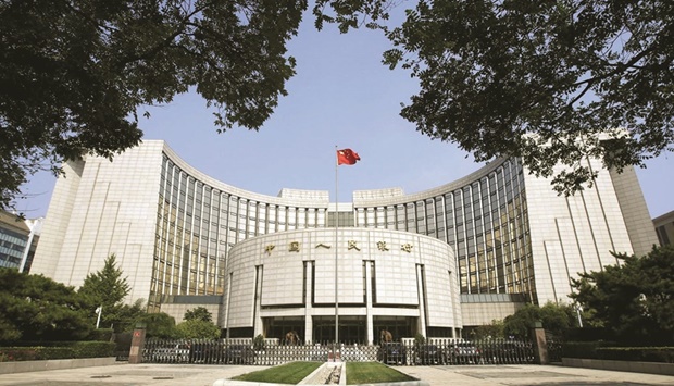 The PBoC headquarters is pictured in Beijing. The bank has pledged to step up support for the slowing economy, but analysts say the room to ease policy could be limited by worries about capital outflows, as the US Federal Reserve raises interest rates.