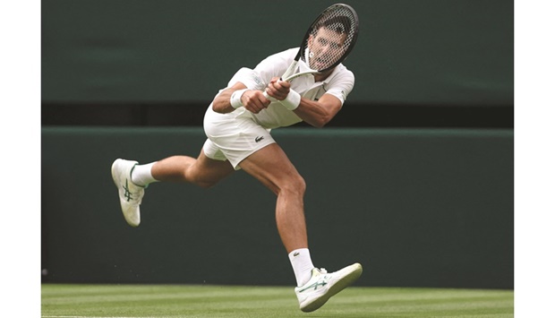 Serbiau2019s Novak Djokovic returns the ball to South Koreau2019s Kwon Soon-woo during their 2022 Wimbledon Championships match at The All England Tennis Club in Wimbledon, southwest London, yesterday. (AFP)