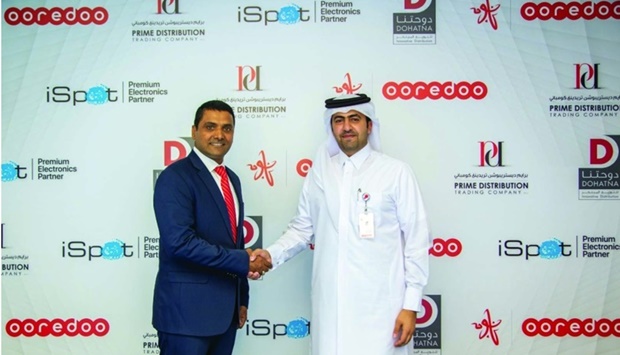 Officials mark the partnership between Ooredoo and ABA Holding's Dohatna Innovative Distribution and PDTC.
