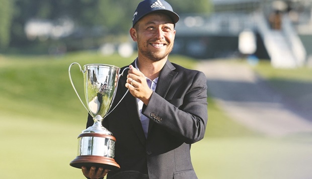 Xander Schauffele holds up the trophy after winning the Travelers Championship in Cromwell, Connecticut, US. (USA TODAY Sports)