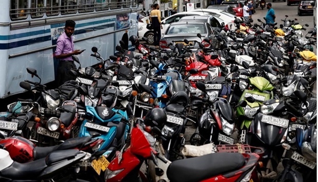 Bikes are parked in a queue to buy petrol due to fuel shortage, amid the country's economic crisis, in Colombo, Sri Lanka, June 28, 2022. REUTERS