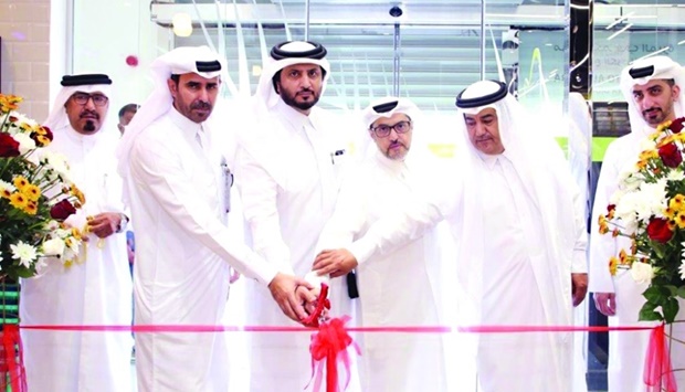 Al Meera officials inaugurating the company's new branch in Al Karaana