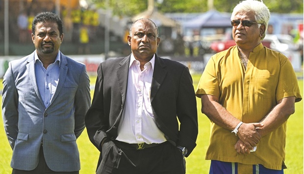 Sri Lankau2019s cricket legends Muttiah Muralitharan (left), Aravinda de Silva (centre) and Arjuna Ranatunga during the first day of the first Test between Sri Lanka and Australia at the Galle International Cricket Stadium in Galle. (AFP)