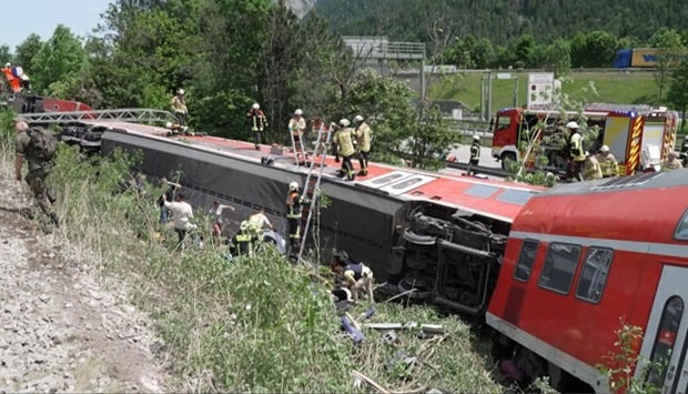 This video grab taken from footage of Network Pictures shows rescue services at the site of a derailed train near Burgrain, southern Germany. AFP/Network Pictures