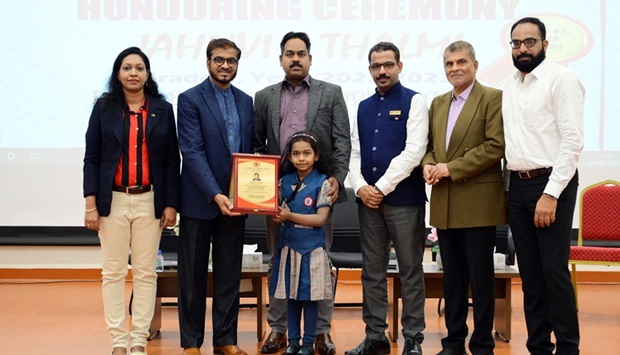 The plaque of appreciation being handed over to Jahnvi S Thalmi.