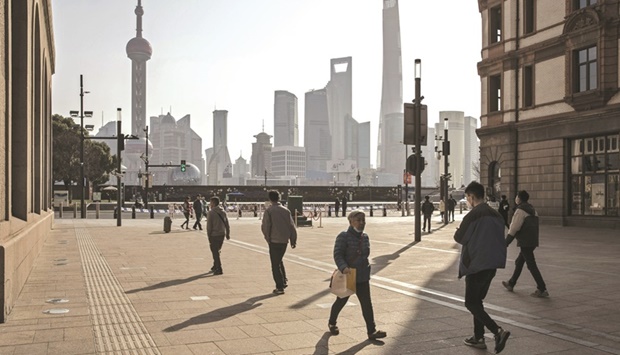 Pedestrians along Nanjing Road near the Bund in Shanghai. Some of Asiau2019s most risk-sensitive currencies and stocks are back in favour as China reopens its economy and traders bet that the dollar may have peaked for now.