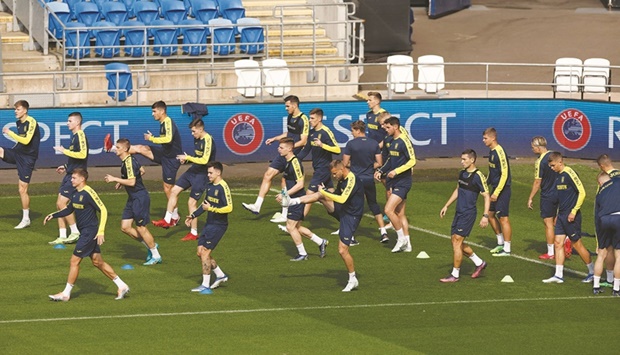 Ukraine players during a training session in Caediff yesterday, ahead of their World Cup UEFA qualifier match against Wales. (Reuters)