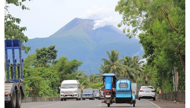 Steam is released from Bulusan Volcano as seen from Casiguran town, Sorsogon Province, after the sudden eruption of the volcano. AFP