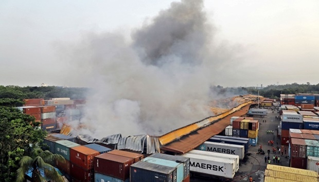 smoke billowing after a fire broke out at a container storage facility in Sitakunda, about 40 km from the key port of Chittagong. AFP