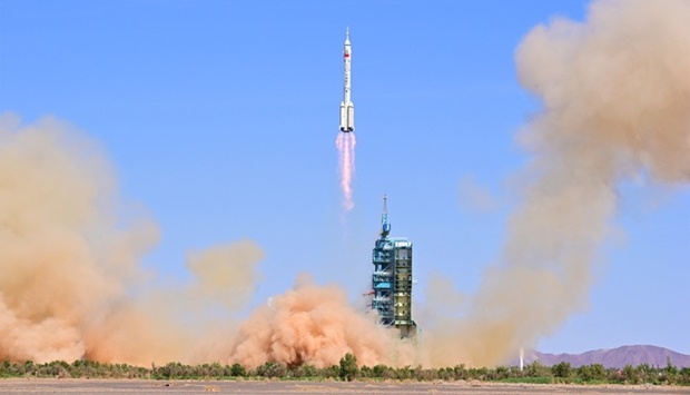 The Long March-2F carrier rocket, carrying the Shenzhou-14 spacecraft and three astronauts, takes off from Jiuquan Satellite Launch Center for a crewed mission to build China's space station, near Jiuquan, Gansu province, China. cnsphoto via REUTERS