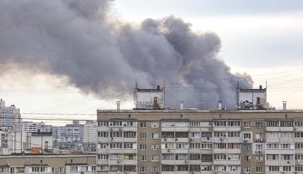 Smoke rises after Russian missile strikes in Kyiv yesterday. (Reuters)
