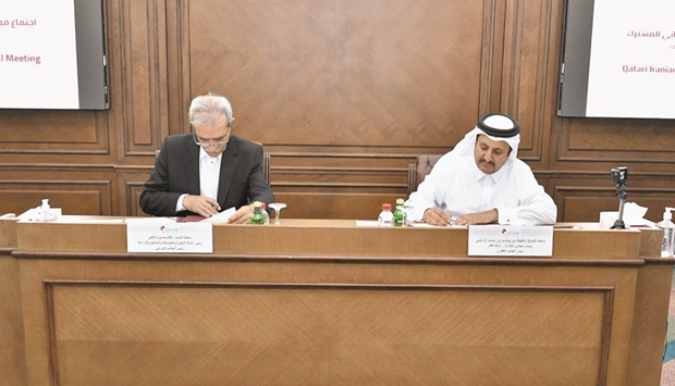 Qatar Chamber chairman Sheikh Khalifa bin Jassim al-Thani and ICCIMA president Gholam Hossein Shafei signing the memorandum of understanding (MoU) for the establishment of the Qatar-Iran Joint Business Council.