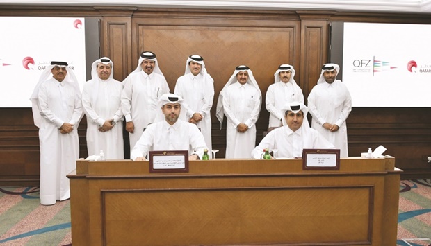 Sheikh Mohamed H F al-Thani, deputy CEO and chief strategy officer of QFZA, and Qatar Chamber general manager Saleh bin Hamad al-Sharqi during the signing of the agreement, which was held in the presence of HE the Minister of State and Chairman of Qatar Free Zones Authority Ahmad al-Sayed and Qatar Chamber chairman Sheikh Khalifa bin Jassim al-Thani.