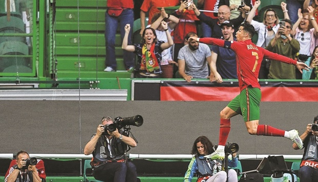 Portugalu2019s forward Cristiano Ronaldo celebrates after scoring a goal during the UEFA Nations League match between against Switzerland at the Jose Alvalade Stadium in Lisbon. (AFP)