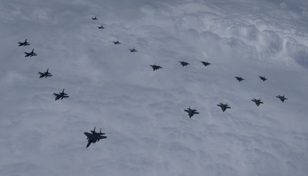 Jet fighters from US and South Korea air forces conduct a formation flight during their military exercise in an unidentified location, South Korea. The Defense Ministry/Yonhap via REUTERS