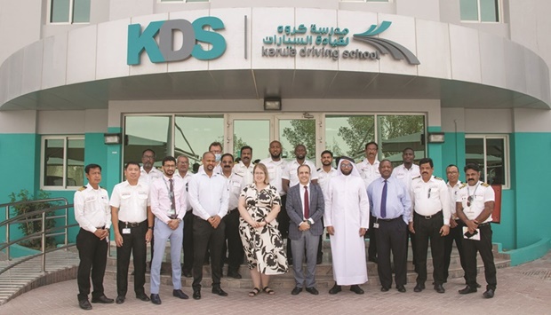 Resource persons and KDS officials with some of the driving instructors who participated in the workshop.