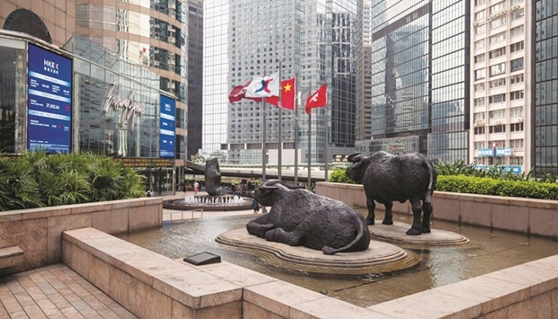 Sculptures stand outside the Hong Kong Stock Exchange. The Hang Seng Index closed up 2.2% to 22,014.59 points yesterday.