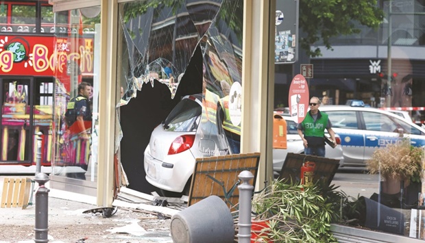 The car that ploughed into a shop front in a busy shopping street in Charlottenburg district after it drove into a crowd yesterday. (AFP)