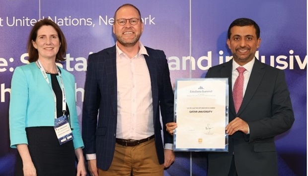 QU president Dr Hassan al-Derham receiving the QS award.