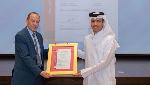 Qatar Olympic Committee Secretary-General HE Jassim bin Rashid al-Buenain (left) receives the Event Sustainable Management Certification (ISO20121:2012 ESMS) from Bureau Veritasu2019 CEO Hussam Refaai at the QOC headquarters on Thursday.