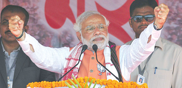 Narendra Modi addresses an election rally in Nagaon district of Assam yesterday.
