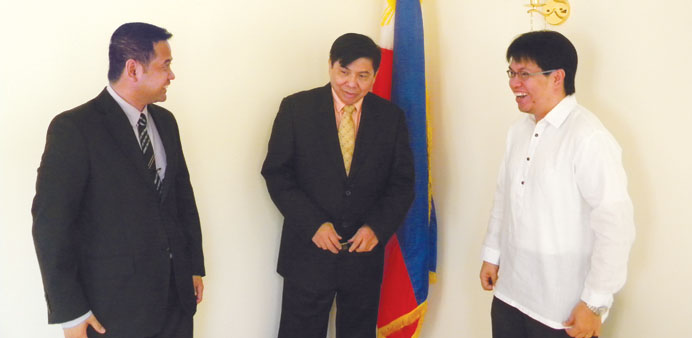 Vice consul Gilbert Segarra (left), ambassador Crescente Relacion (centre) and vice consul Melvin C Almonguera discuss a point at the new Philippine e