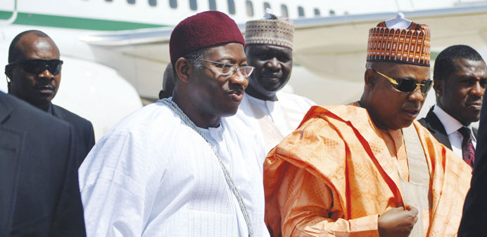 Nigeriau2019s President Goodluck Jonathan  arrives with other officials during a visit to Borno state yesterday.