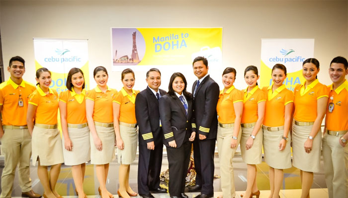 Cebu Pacific Air crew pose with officials