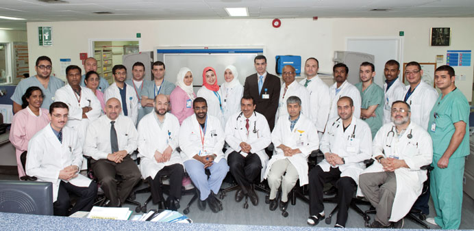   Dr Ibrahim Fawzy (seated fourth from left) poses in a group photo with the ECMO team.