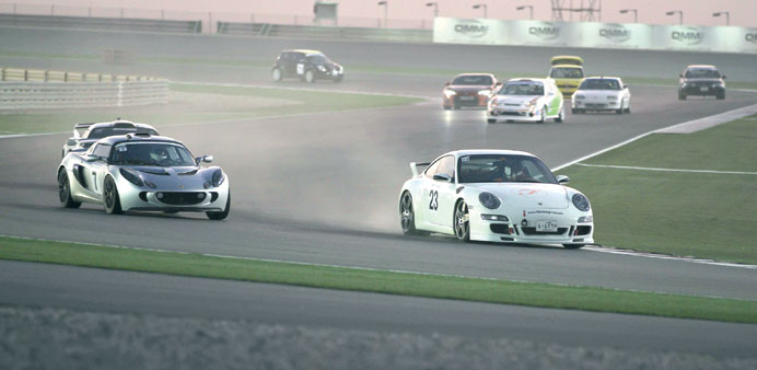 Abdulaziz Abdulla leads Pavel Nedobity during the sixth round of the Qatar National Road Racing Championship at the Losail International Circuit.