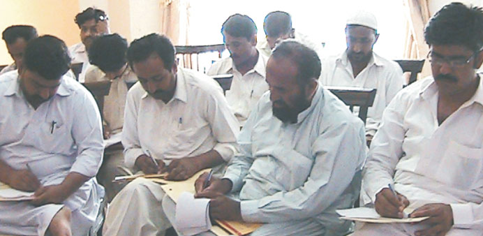 Participants take notes at one of the workshops.