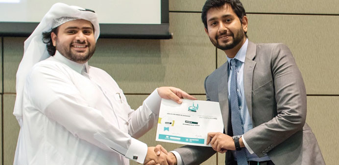 Sheikh Jassim presenting Mohamed Bilal Shakir with the EBDA Silver Award.