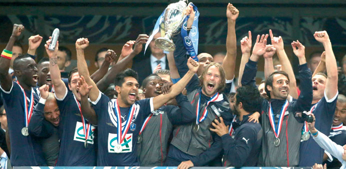 Bordeaux players celebrate with the French Cup trophy after beating Evian in the final at the Stade de France in Saint-Denis, outside Paris, on Friday