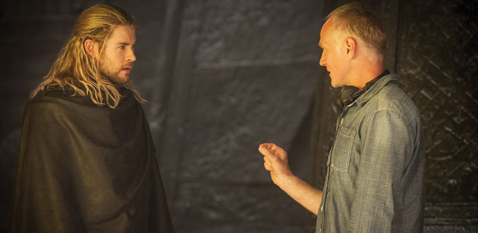 Director Alan Taylor and star Chris Hemsworth on the sets of Thor.
