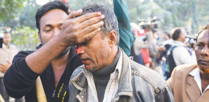 An injured supporter from the Bangladesh Awami League is seen after a clash with supporters from the Bangladesh Nationalist Party during a protest in 