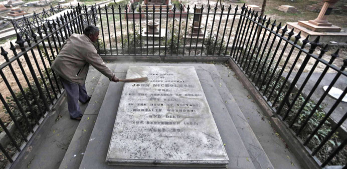 A worker cleaning the  grave of Brigadier General John Nicholson, who was mortally wounded at the age of 36 leading the assault to relieve the siege o