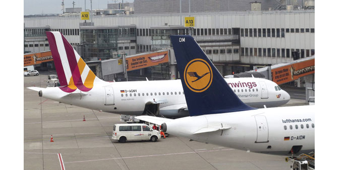  Germanwings and Lufthansa planes are seen at Dusseldorf airport. The families of passengers on the doomed jet operated by Germanwings will be able to