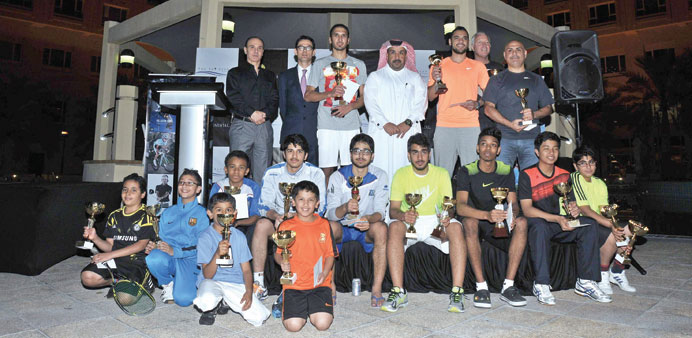 Winners of the Intercontinental Squash Tournament pose after the presentation ceremony yesterday.