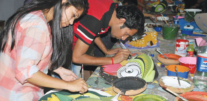 Art students of Dhaka University paint paper masks for upcoming Bengali New Year 1420 in Dhaka. The Bangladeshi people will celebrate the Bengali New 