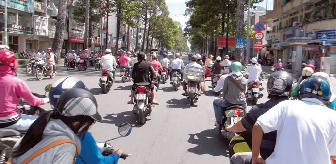 * Motorbikes are the main means of transport for the Vietnamese people. A busy street in HCMC.