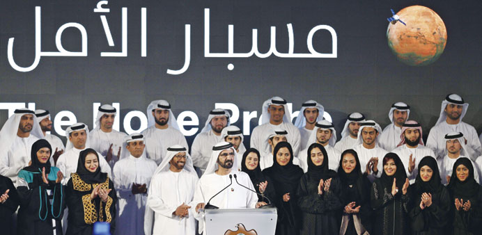 Sheikh Mohamed bin Rashid al-Maktoum, UAE vice president and ruler of Dubai, speaks among engineers and scientists during a ceremony to unveil the UAE