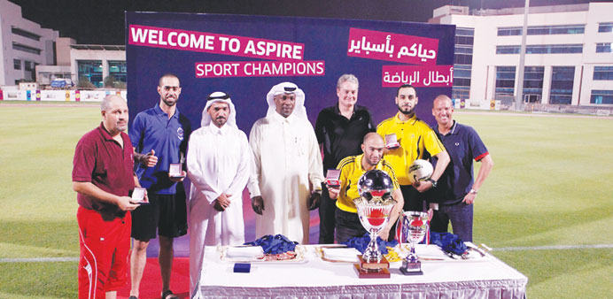 Abdullah al-Khater and Philip Templer with some of the winners of the tournament held as part of the Ramadan Festival organised by AZF.