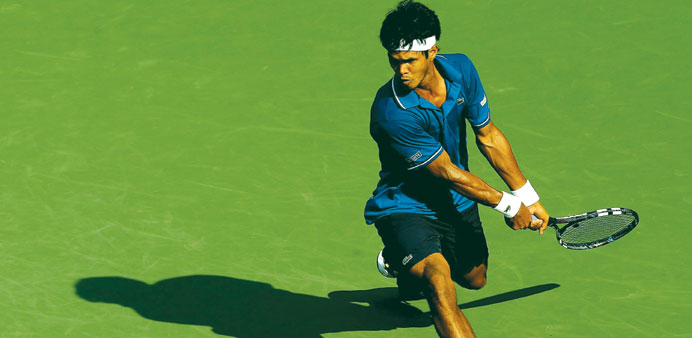 Somdev Devvarman of India returns a shot to defending champion Alexandr Dolgopolov of Ukraine during the Citi Open at the William H G FitzGerald Tenni