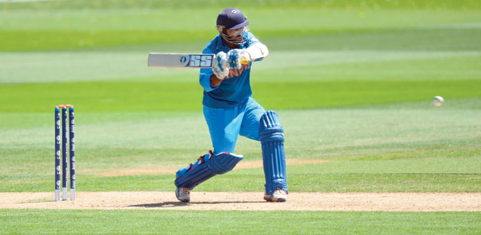Indiau2019s Dinesh Karthik plays a shot during the warm-up tie  against Australia at The Cardiff Wales Stadium in Cardiff yesterday. (AFP)