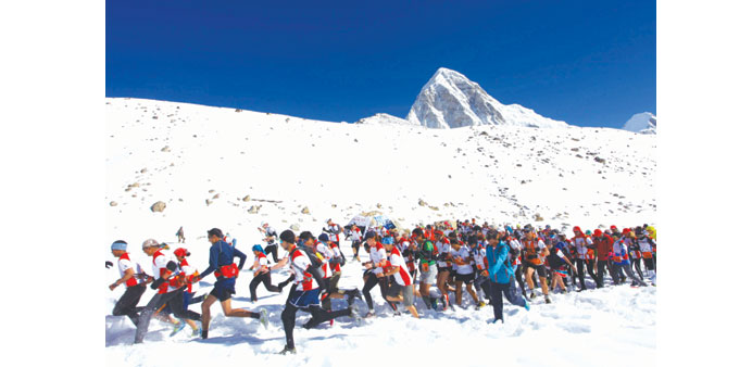  In this file photo taken in May last year, participants from different countries and regions compete during the worldu2019s highest marathon event at Eve