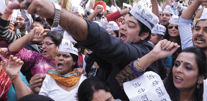 AAP activists stage a demonstration against BJP lawmaker Sharma in New Delhi yesterday.