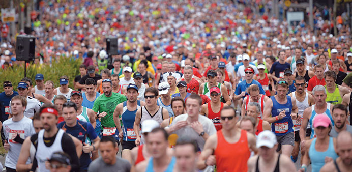  Thousands of runners take part in the annual City2Surf road race in Sydney yesterday.
